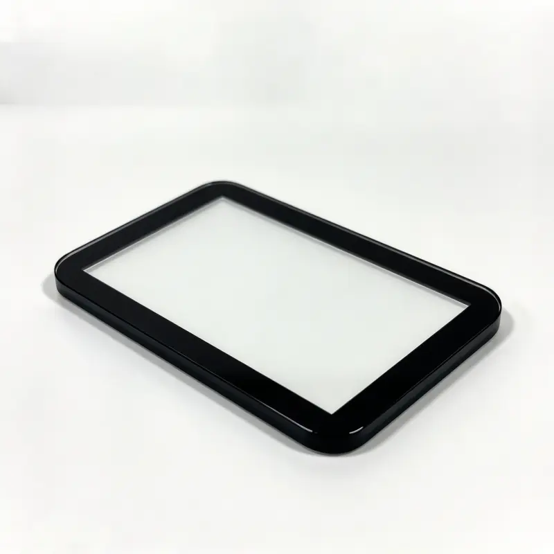 Custom protective glass cover for medical equipment display with precision black frame